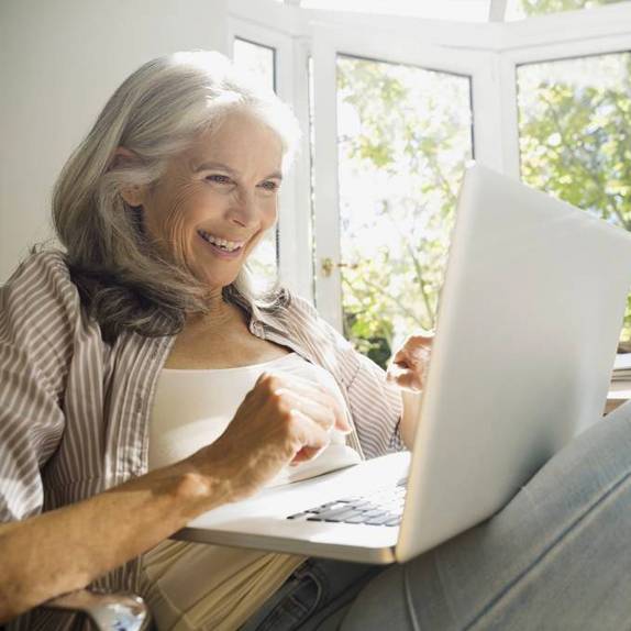 Woman looking at laptop screen